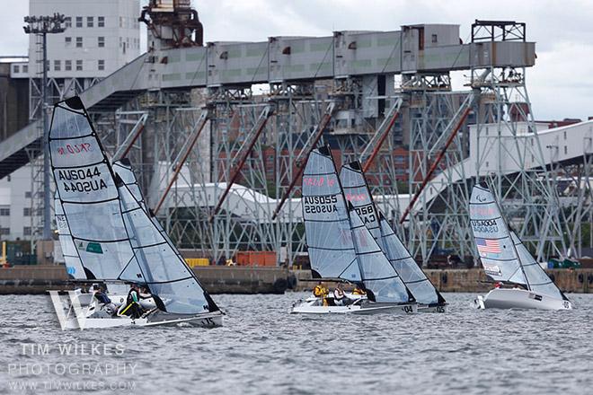 SKUDs with the Halifax grain terminal/waterfront behind them - 2014 IFDS World Championship © Tim Wilkes